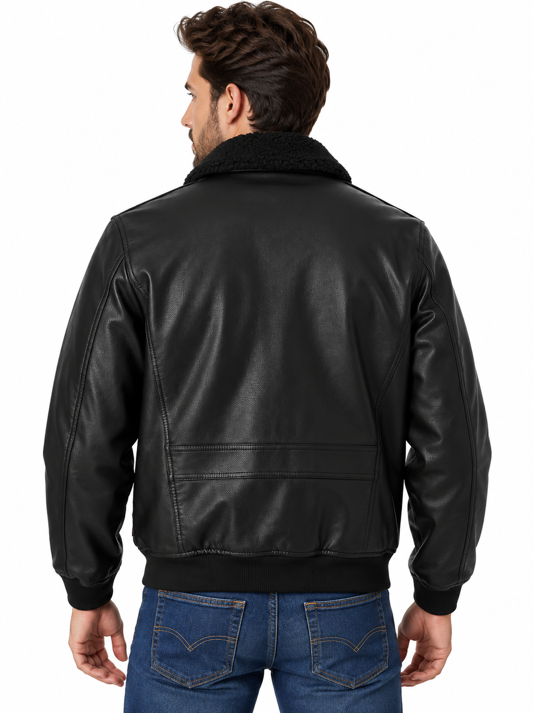 A man viewed from the back wearing a black leather jacket with a black sherpa collar, paired with blue jeans, against a plain white background.